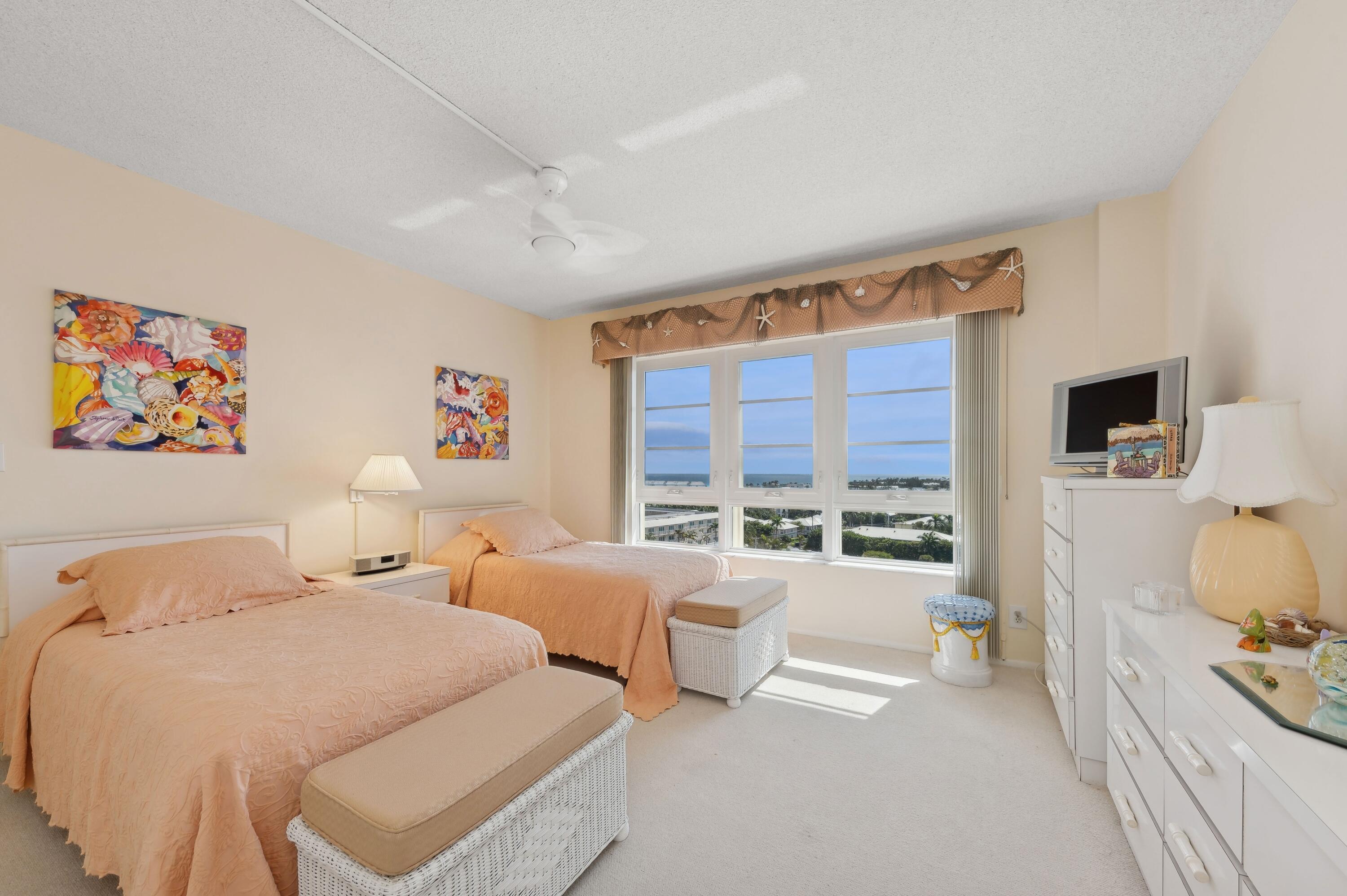 50 E Road, Unit 11F Delray Beach, FL 33483 - Photo 20 of 31 a spacious bedroom with two beds and a large window