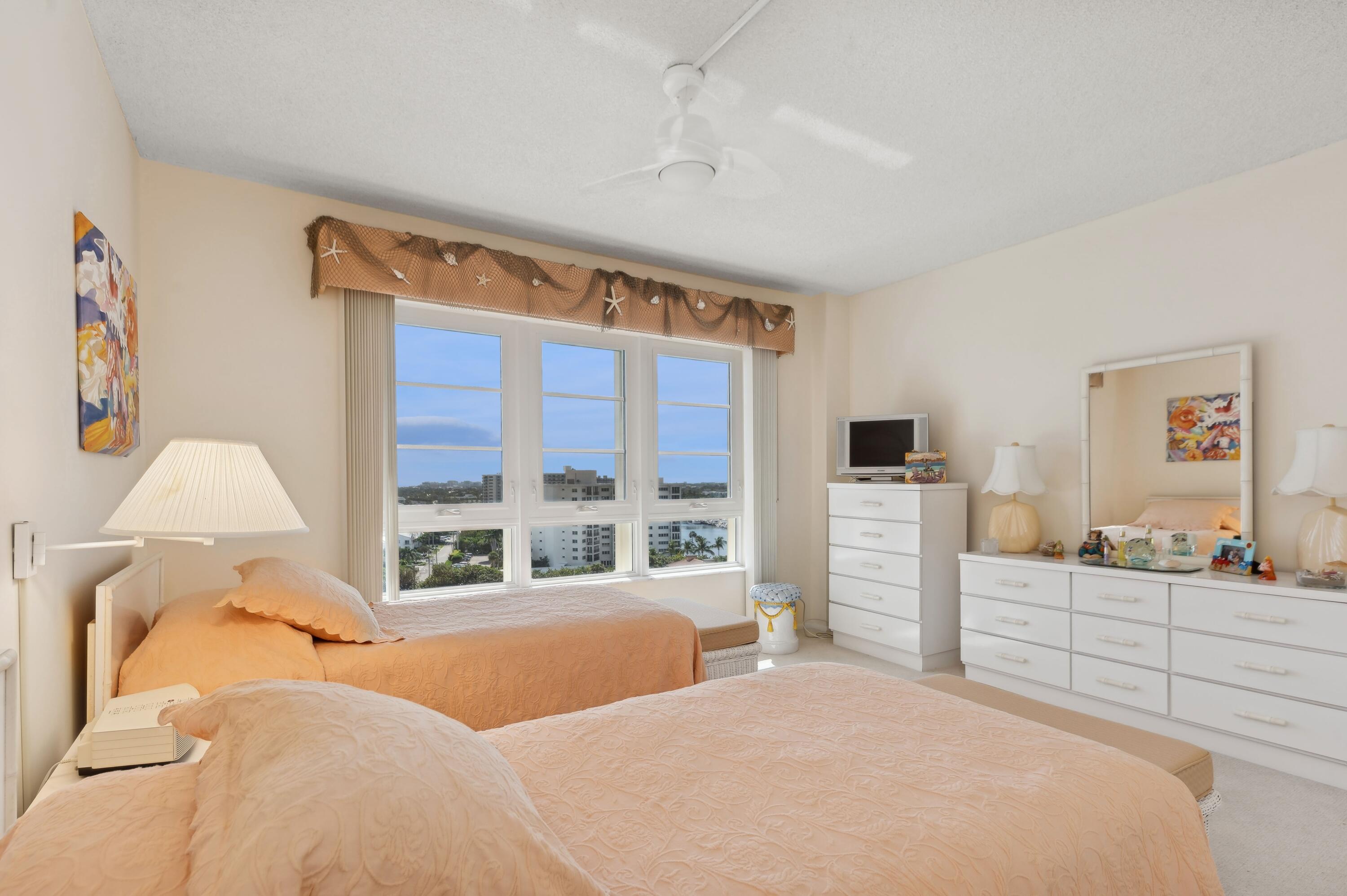 50 E Road, Unit 11F Delray Beach, FL 33483 - Photo 21 of 31 a bedroom with a bed and a large window