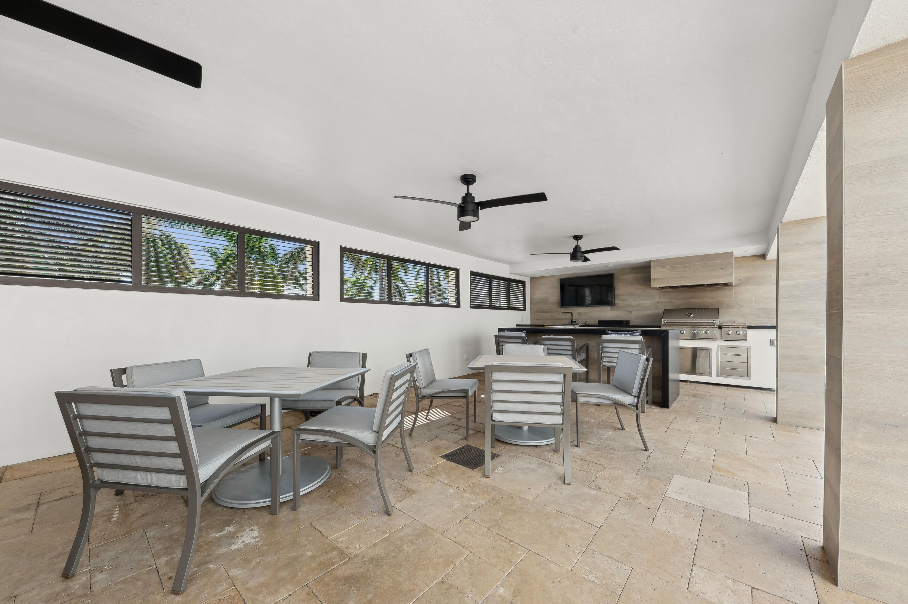 50 E Road, Unit 11F Delray Beach, FL 33483 - Photo 23 of 31 a view of a dining room with furniture