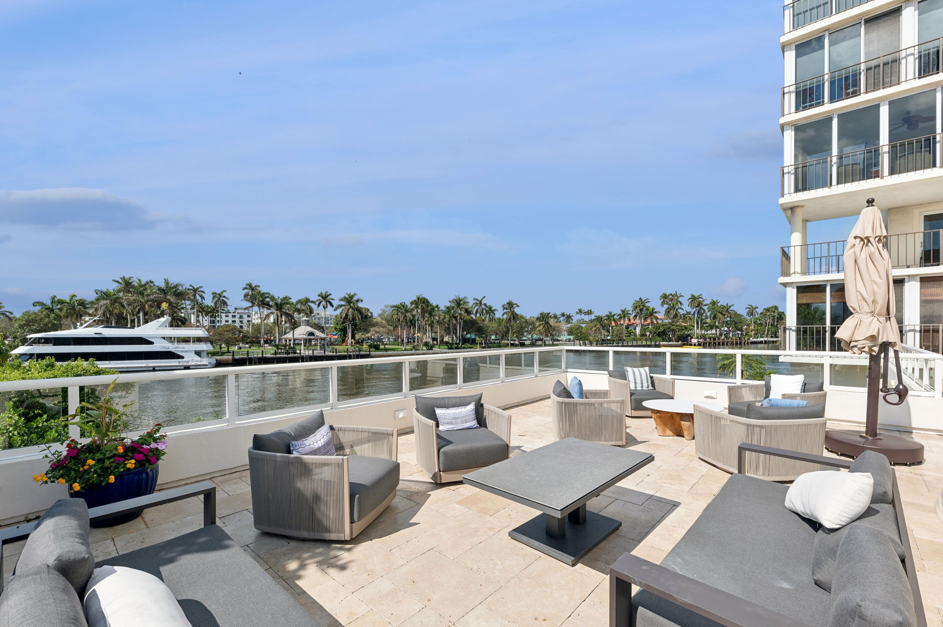 50 E Road, Unit 11F Delray Beach, FL 33483 - Photo 26 of 31 a view of a roof deck with couches and potted plants