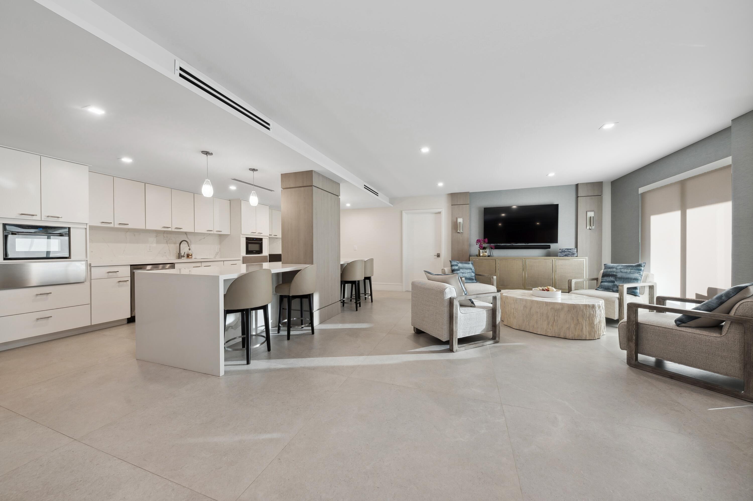 50 E Road, Unit 11F Delray Beach, FL 33483 - Photo 27 of 31 a living room with furniture and a flat screen tv