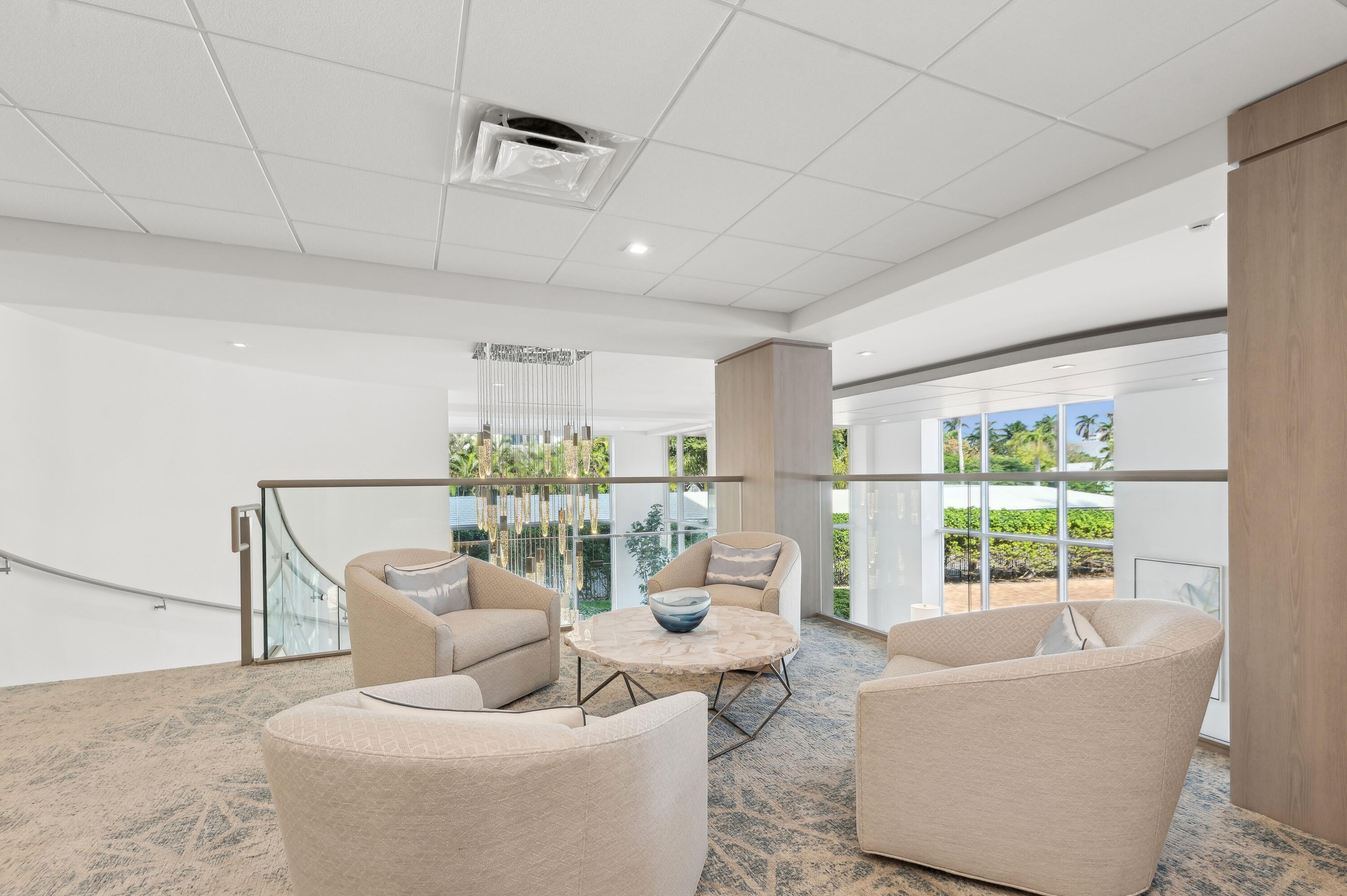50 E Road, Unit 11F Delray Beach, FL 33483 - Photo 28 of 31 a living room with furniture and a large window