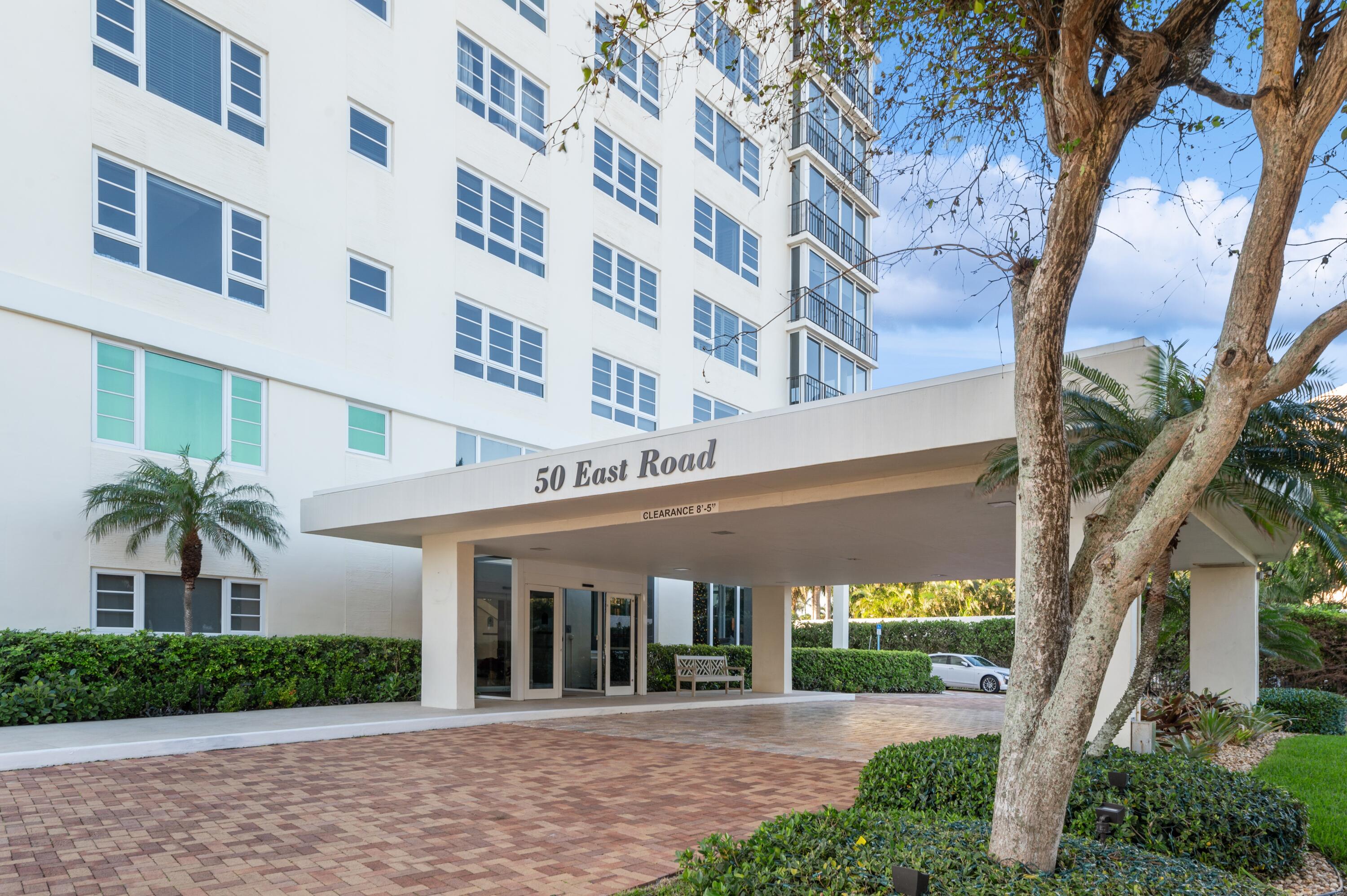 50 E Road, Unit 11F Delray Beach, FL 33483 - Photo 3 of 31 a view of a building with a garden