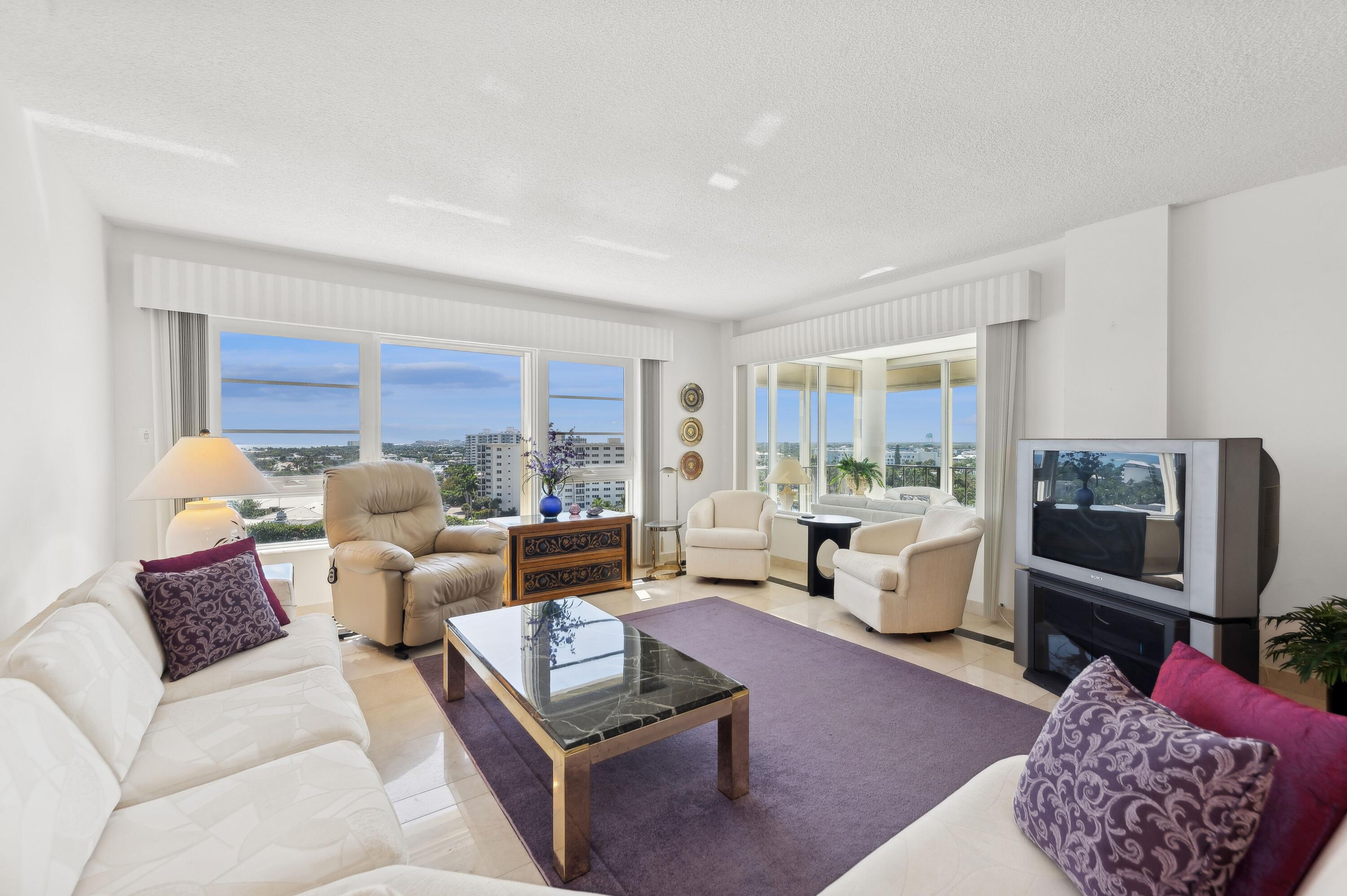 50 E Road, Unit 11F Delray Beach, FL 33483 - Photo 7 of 31 a living room with furniture and a flat screen tv