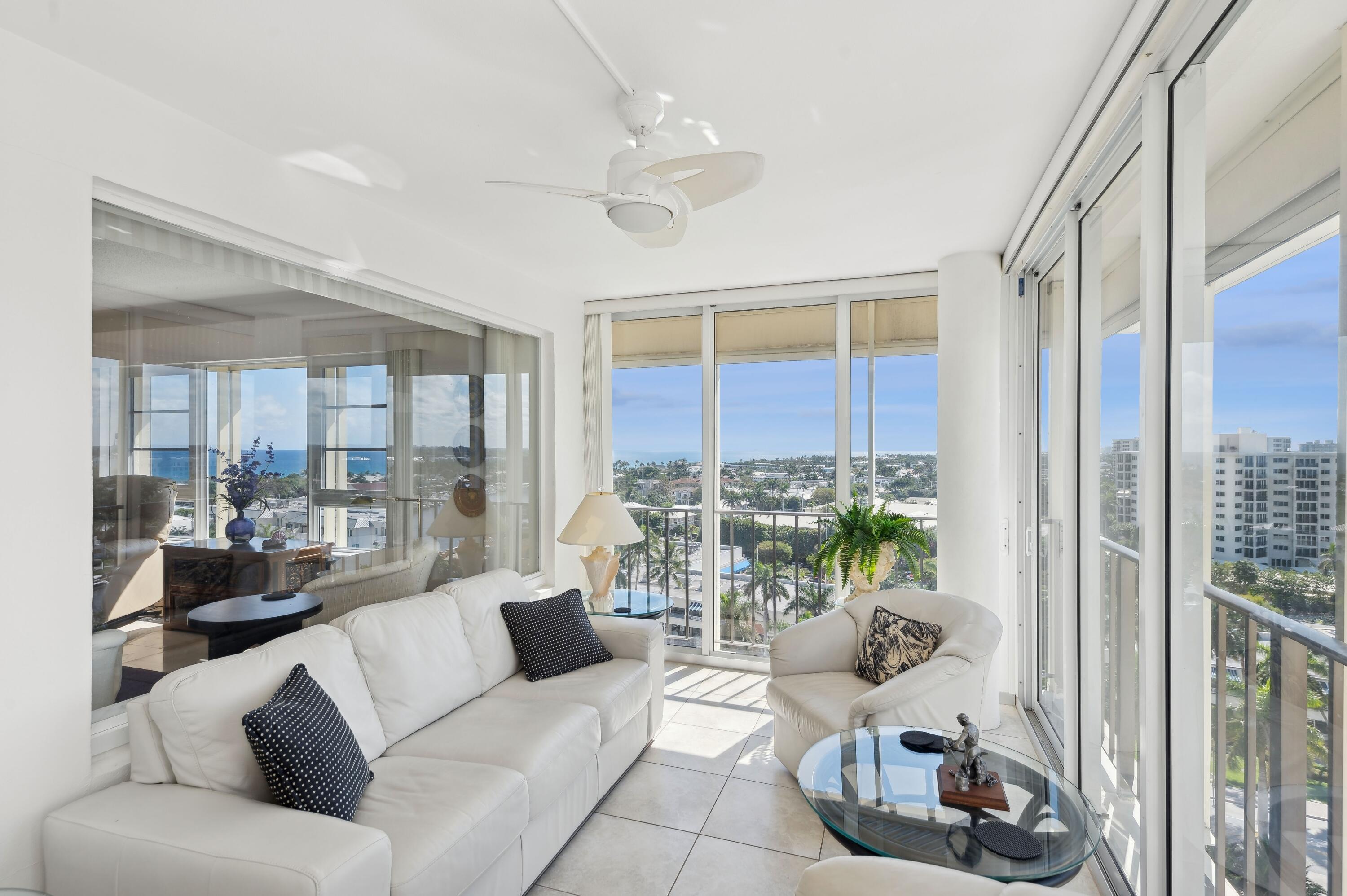 50 E Road, Unit 11F Delray Beach, FL 33483 - Photo 8 of 31 a living room with furniture and a floor to ceiling window