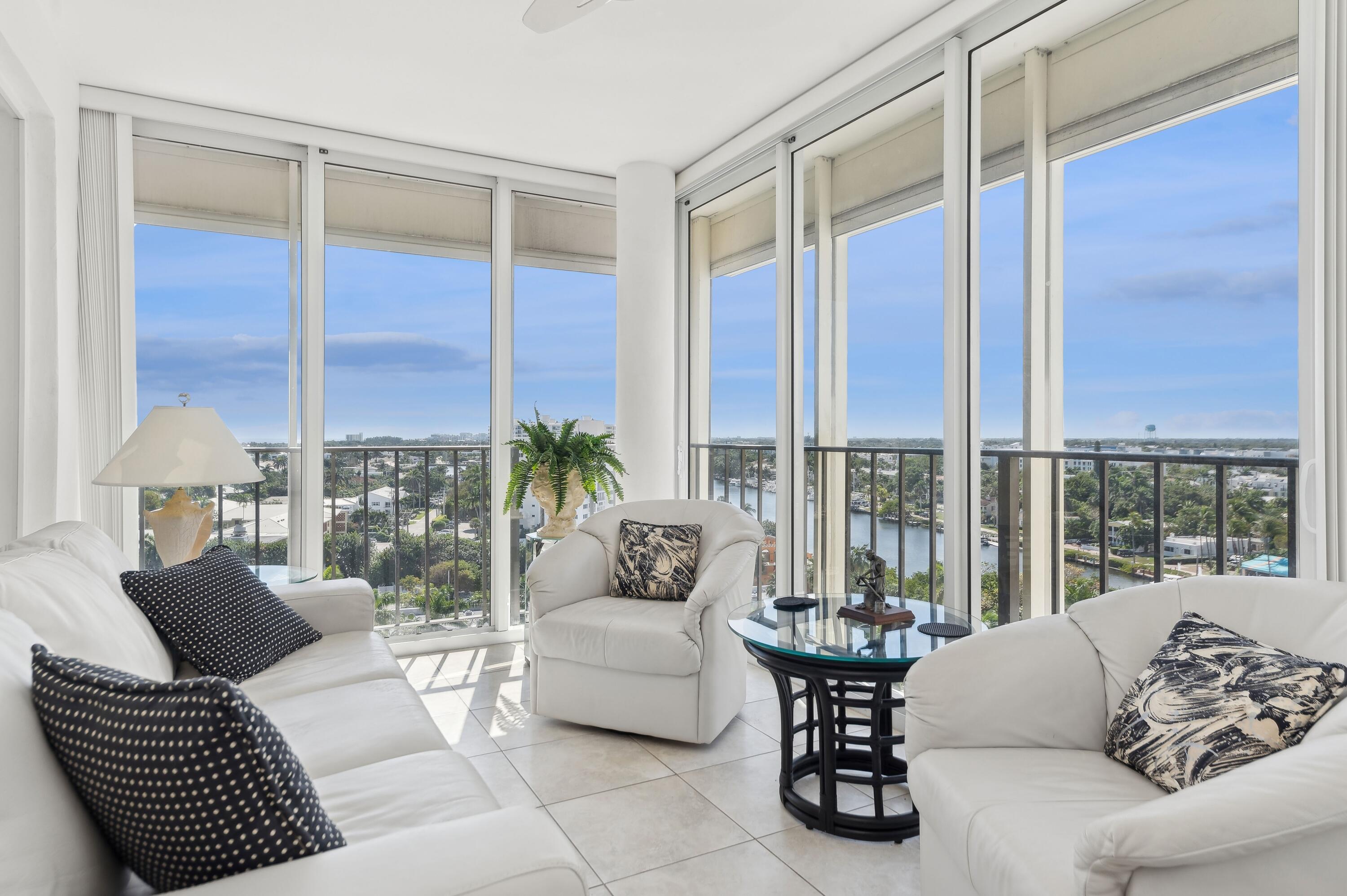50 E Road, Unit 11F Delray Beach, FL 33483 - Photo 10 of 31 a living room with furniture and a large window