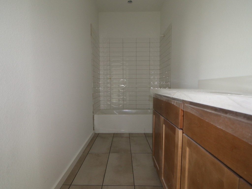 136 Bishop Wood Road Dripping Springs, TX 78620 - Photo 11 of 14 a bathroom with a shower