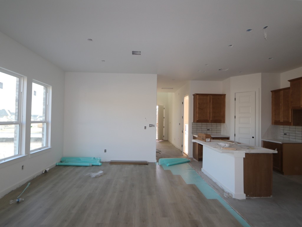 136 Bishop Wood Road Dripping Springs, TX 78620 - Photo 2 of 14 a view of living room kitchen with furniture and flat screen tv
