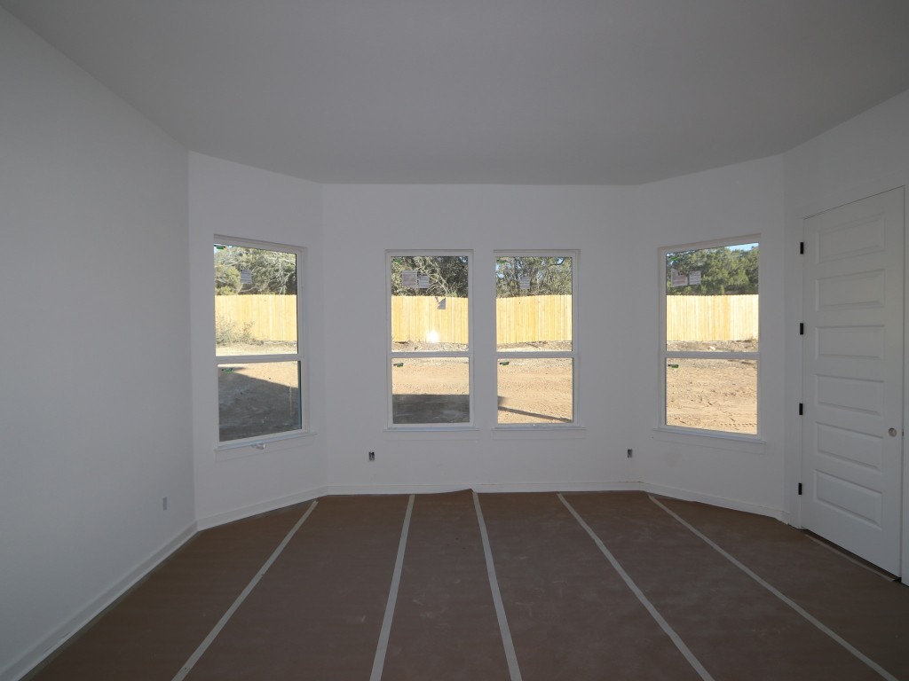 136 Bishop Wood Road Dripping Springs, TX 78620 - Photo 7 of 14 an empty room with windows