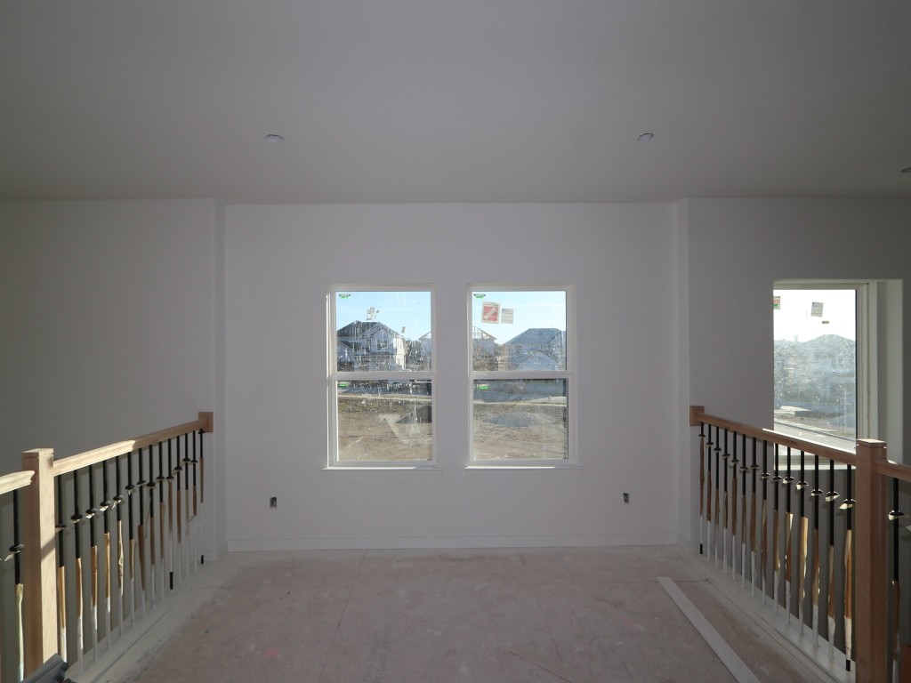 136 Bishop Wood Road Dripping Springs, TX 78620 - Photo 9 of 14 an empty room with windows