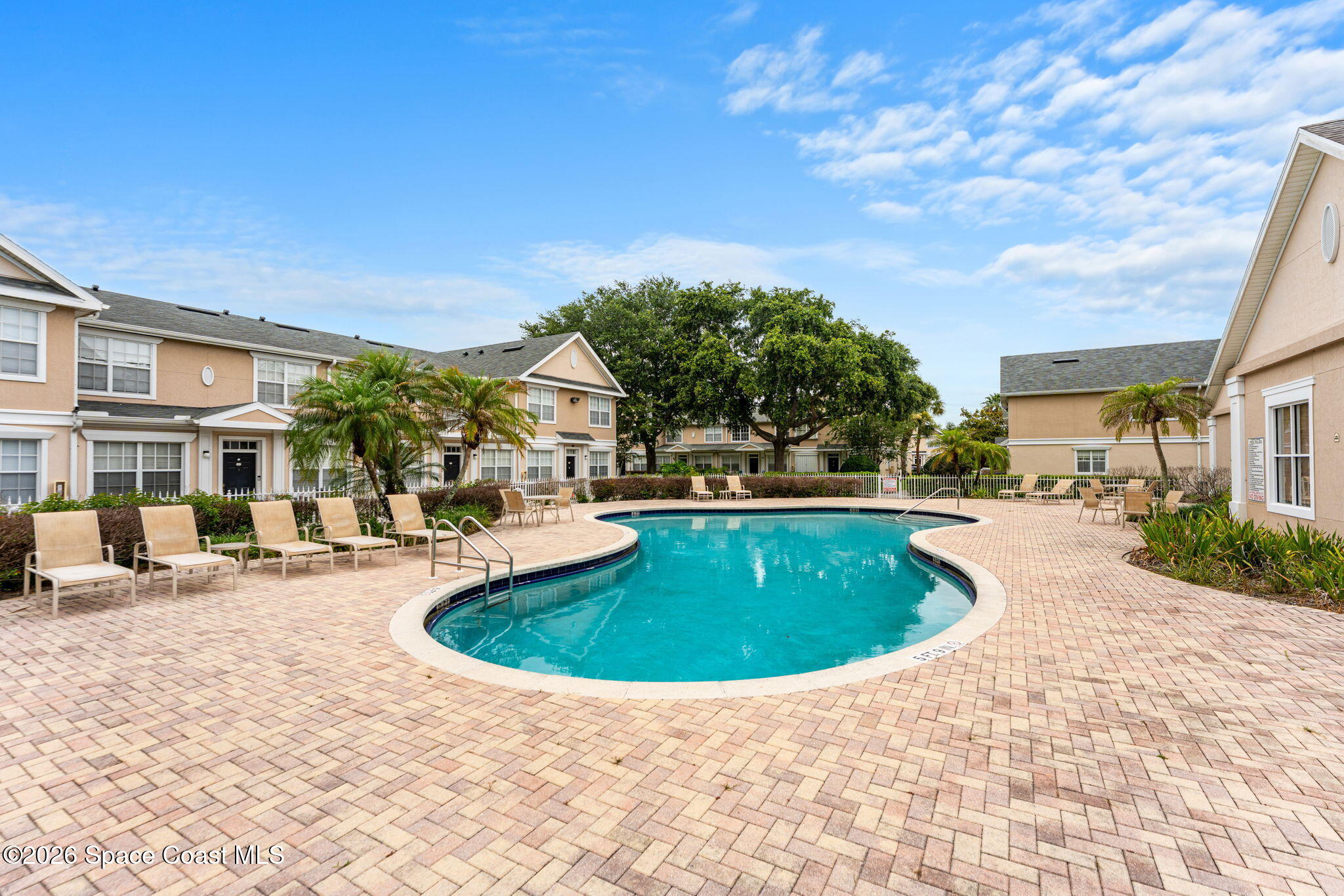 110 Turpial Way, Unit 106 Melbourne, FL 32901 - Photo 45 of 50 a view of outdoor space yard swimming pool and patio
