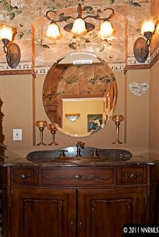 4840 Livery Road Reno, NV 89521 - Photo 9 of 12 a bathroom with a sink and a mirror