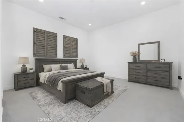 a bedroom with a bed and furniture