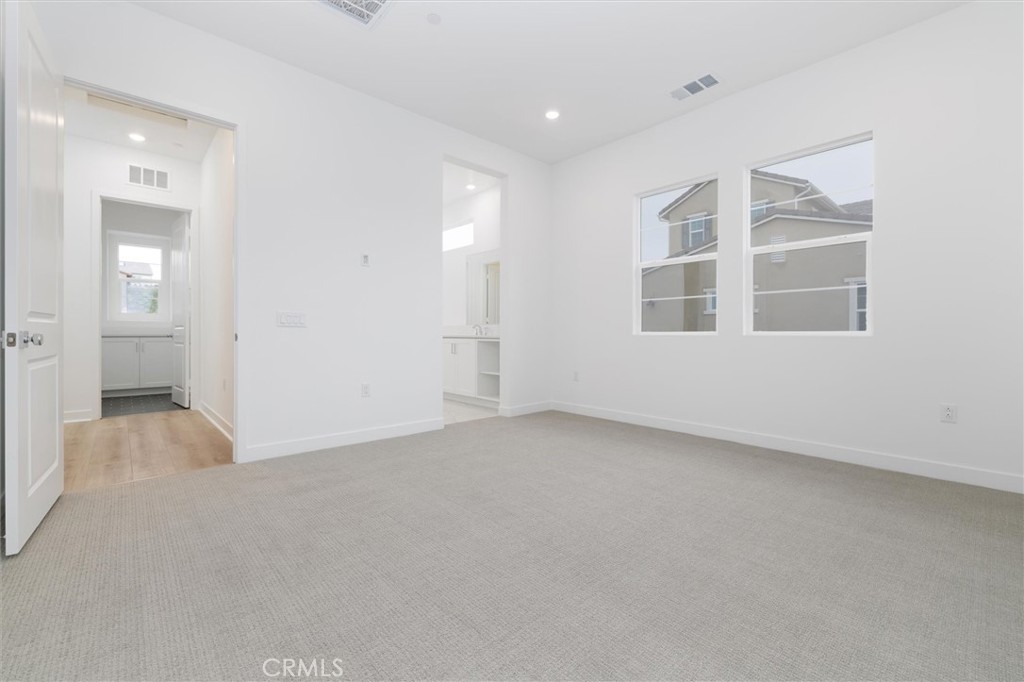 24510 Via La Valencia, CA 91354 - Photo 17 of 25 a view of an empty room with a window