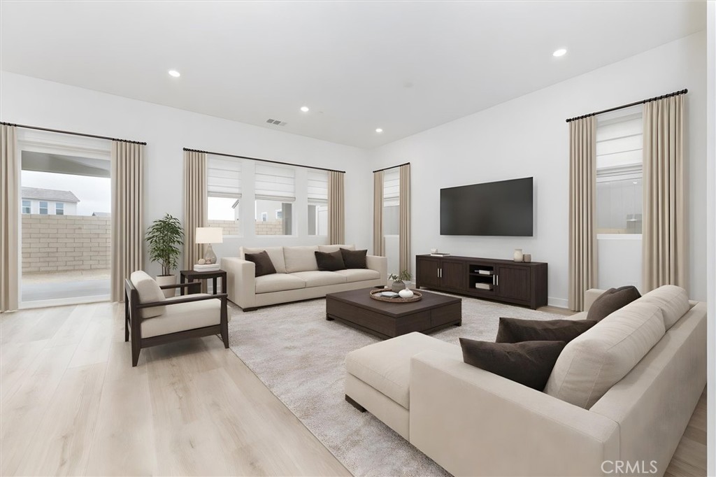 24510 Via La Valencia, CA 91354 - Photo 7 of 25 a living room with furniture and a flat screen tv