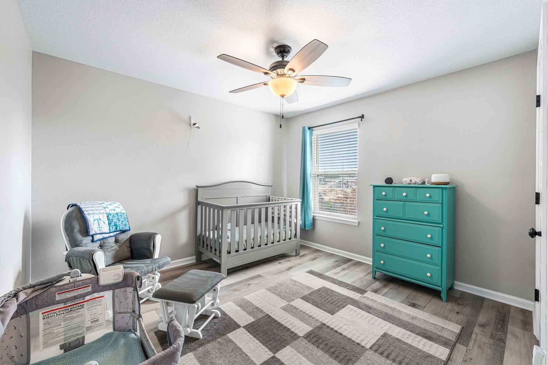 396 This Way Freeport, FL 32439 - Photo 19 of 30 a bedroom with a bed and a window