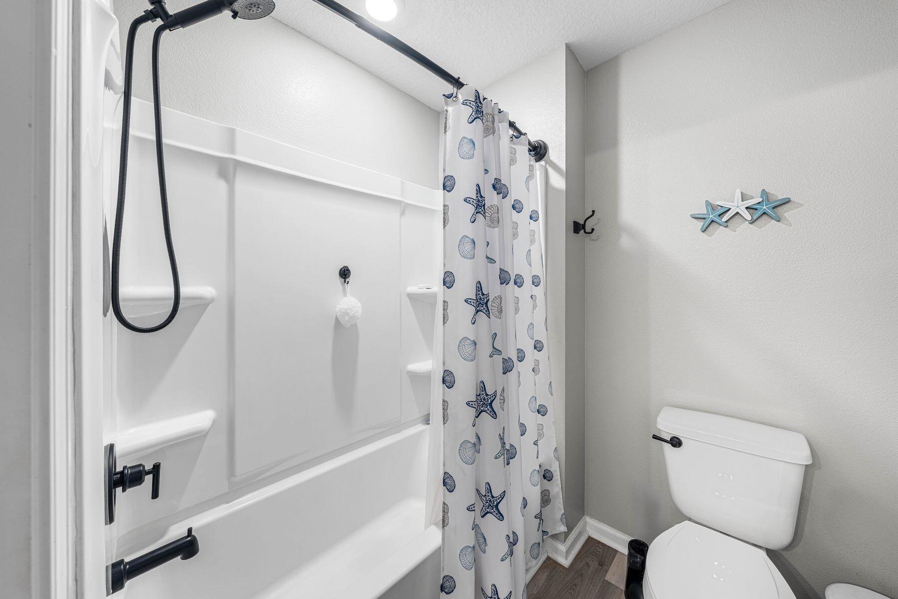 396 This Way Freeport, FL 32439 - Photo 21 of 30 a bathroom with a toilet and a shower