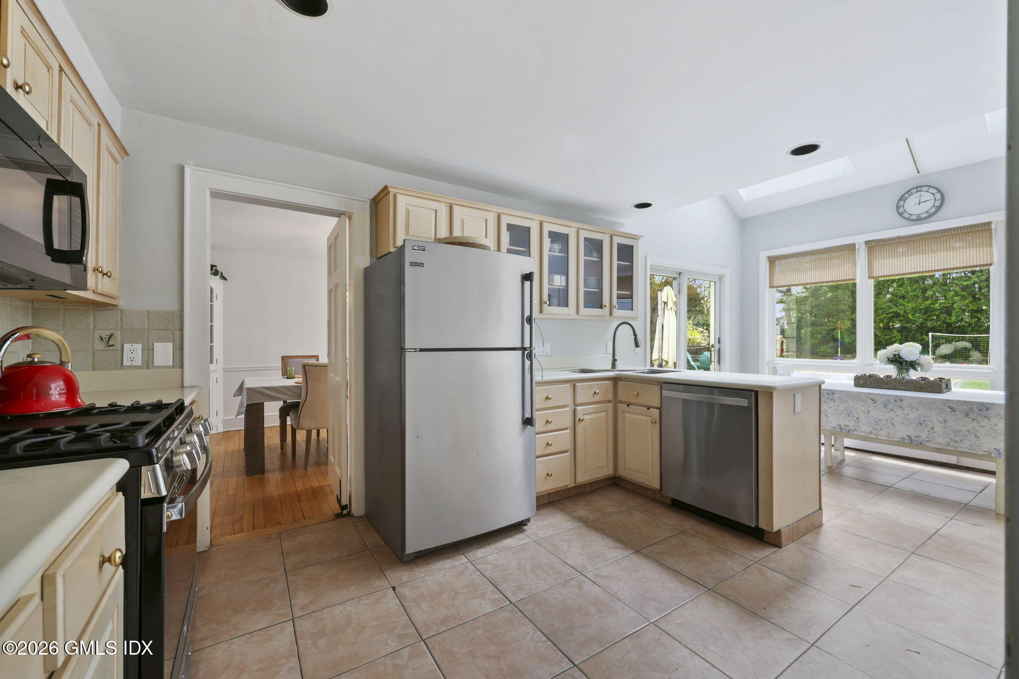 64 Summit Road Riverside, CT 06878 - Photo 12 of 34 a kitchen with a refrigerator and a sink