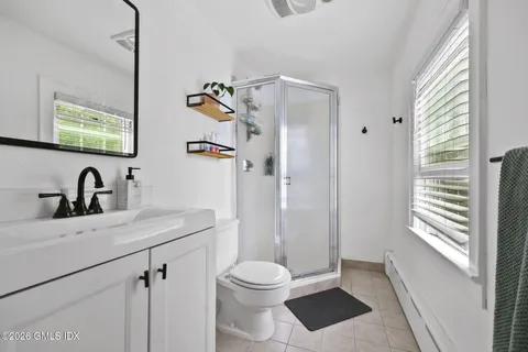 a view of a chairs and table in backyard