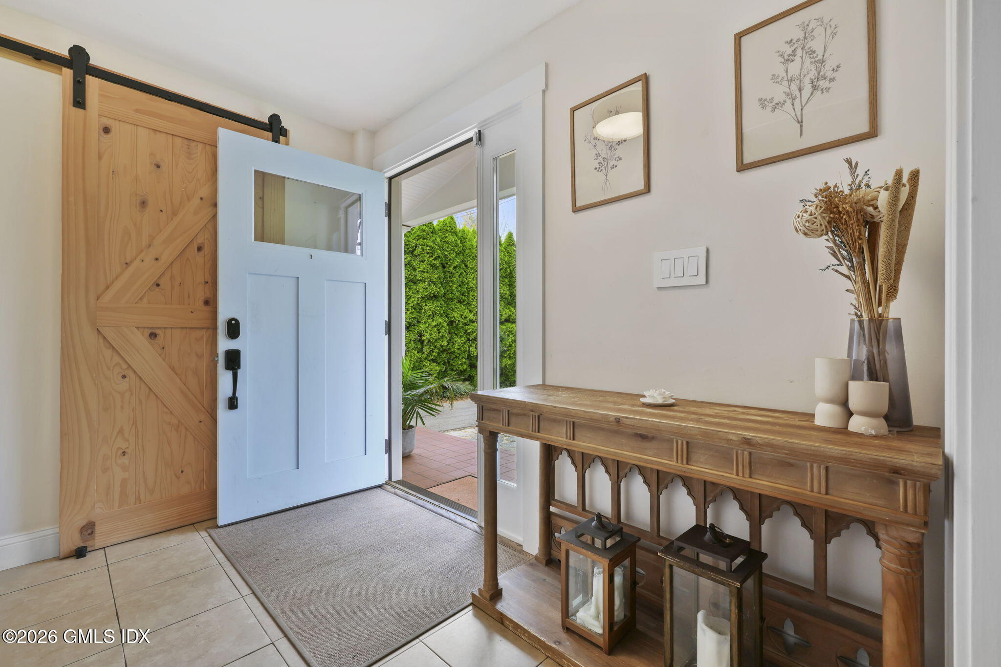 64 Summit Road Riverside, CT 06878 - Photo 2 of 34 a view of an entryway with table and door