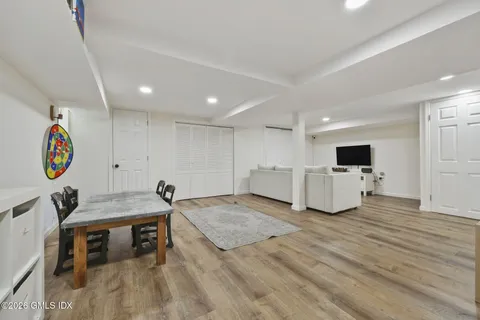 a view of a house with backyard sitting area and garden