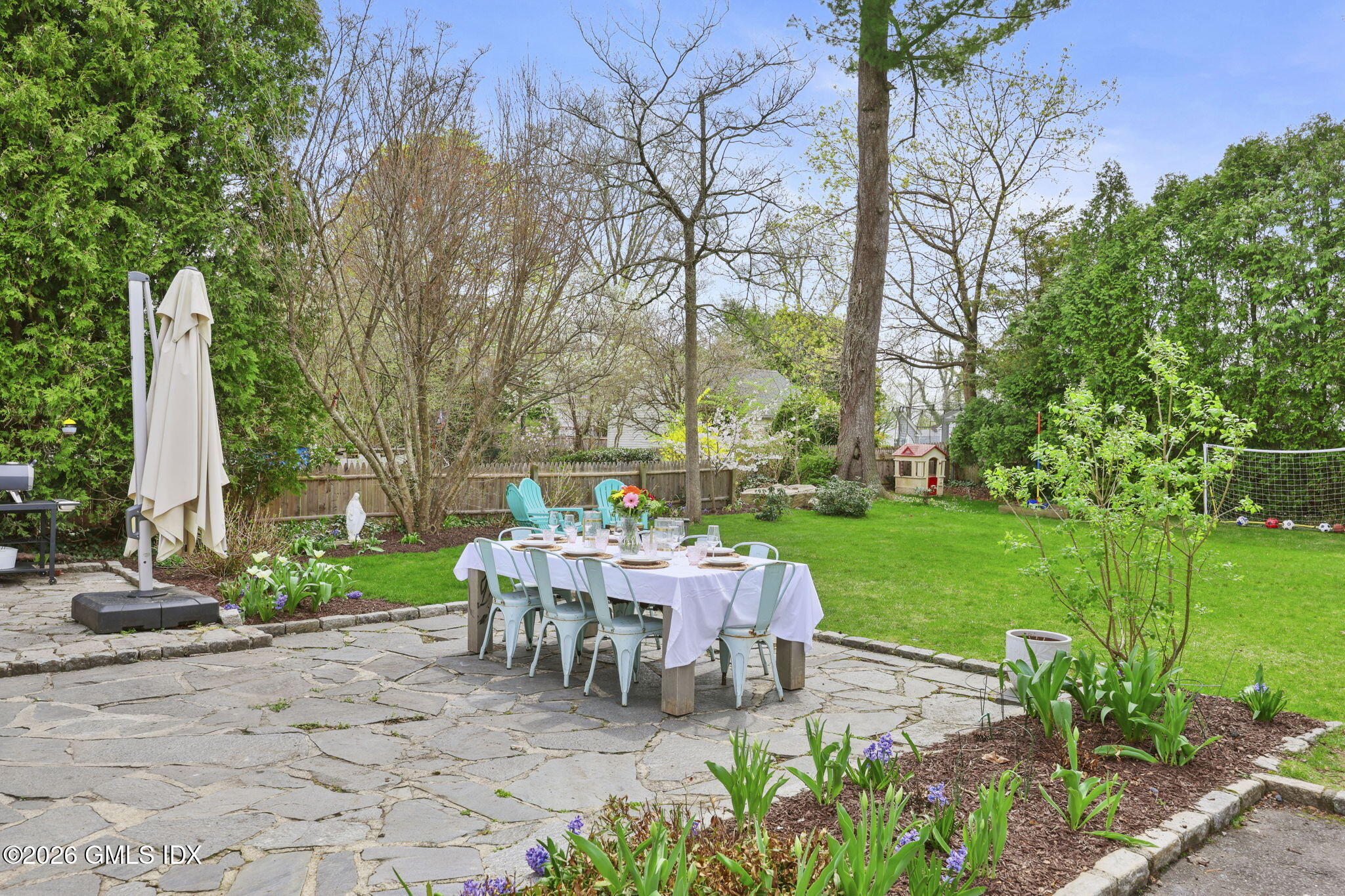 64 Summit Road Riverside, CT 06878 - Photo 25 of 34 a view of a chairs and table in backyard of the house