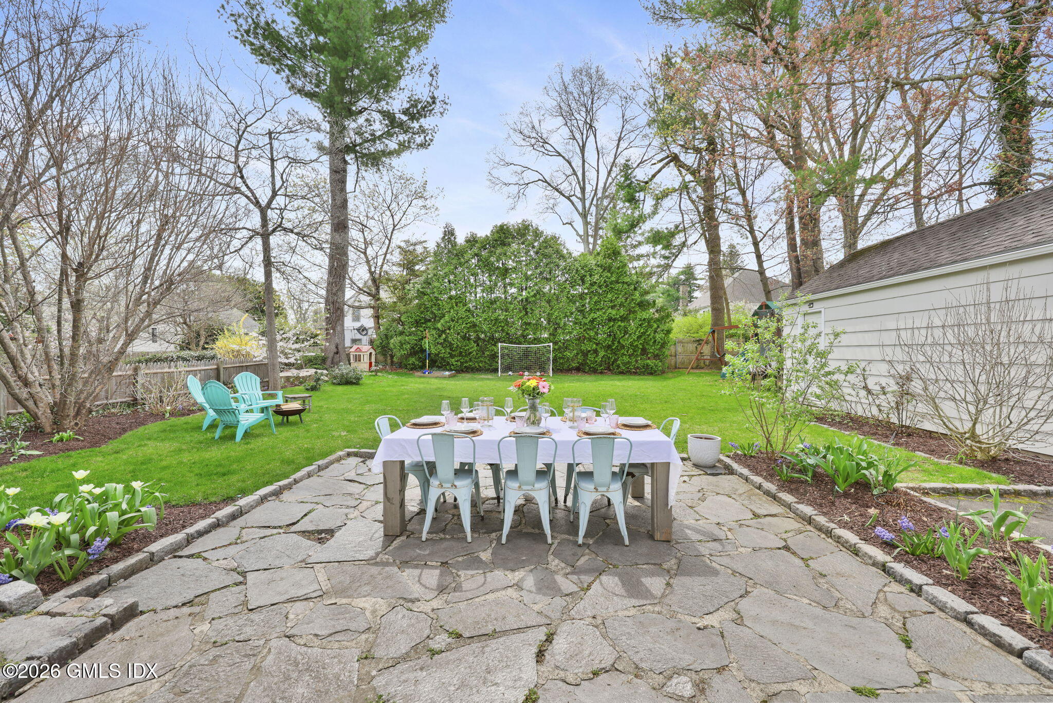 64 Summit Road Riverside, CT 06878 - Photo 26 of 34 a view of a chairs and table in backyard of the house