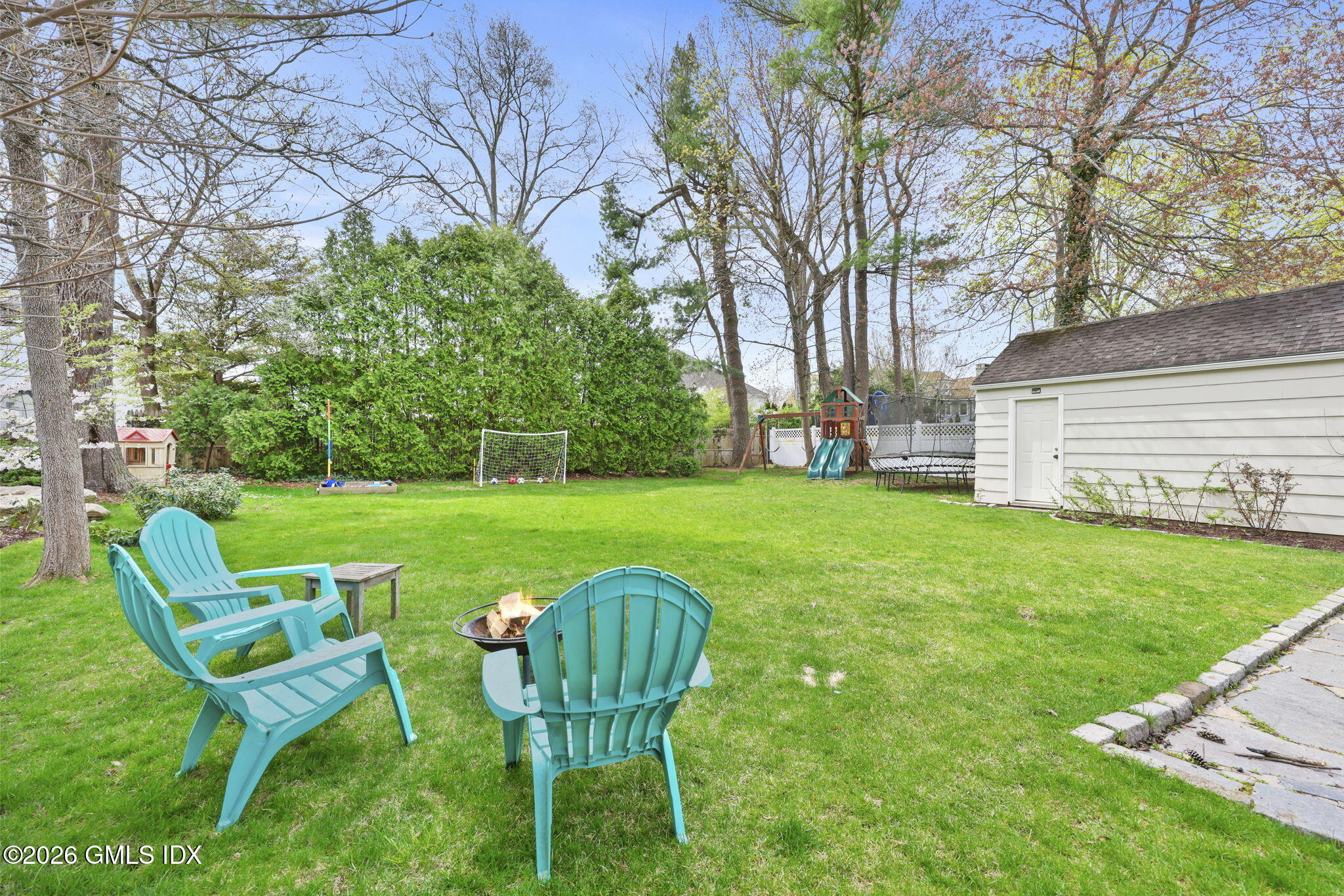 64 Summit Road Riverside, CT 06878 - Photo 27 of 34 a view of a chairs and table in backyard