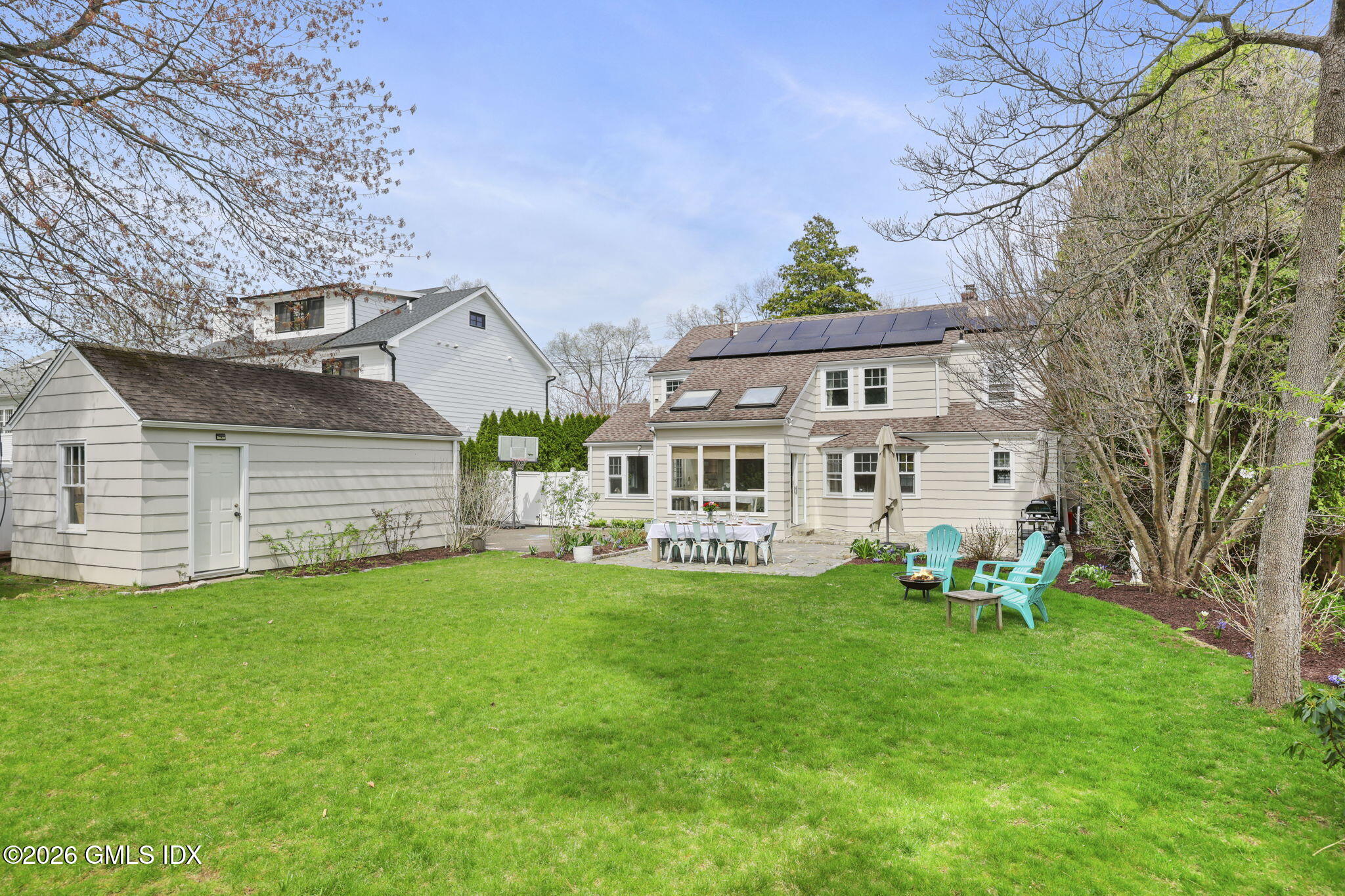 64 Summit Road Riverside, CT 06878 - Photo 28 of 34 a view of a house with a yard porch and sitting area