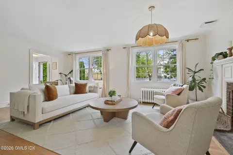 a living room with furniture and a window