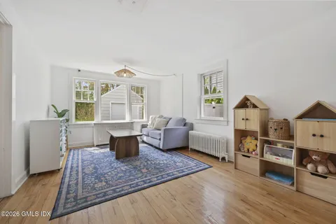 a large bed sitting in a bedroom next to a window