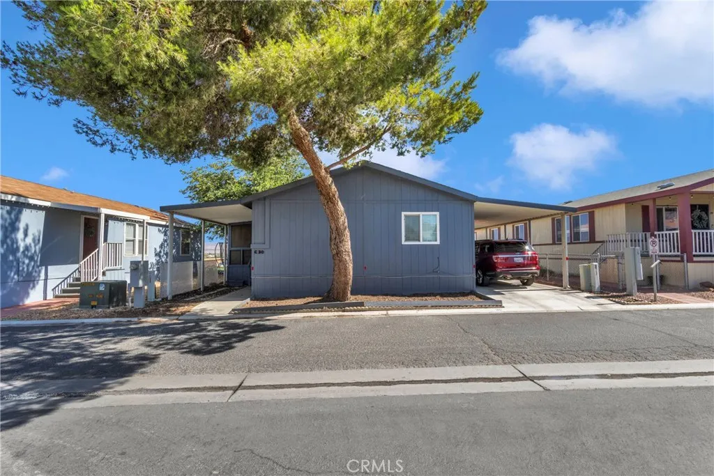 a house with yard in front of it