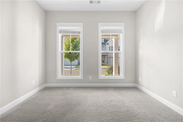 an empty room with windows