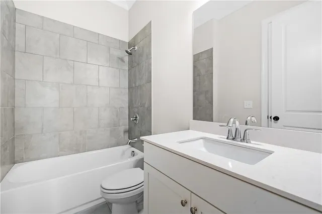 a bathroom with a sink a toilet and a bathtub