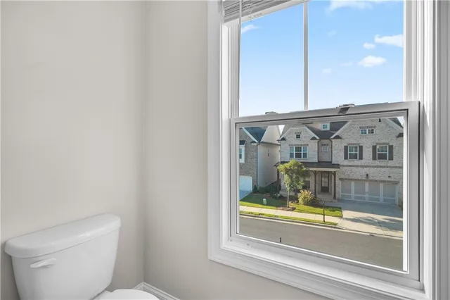 a bathroom with a bathtub and a window