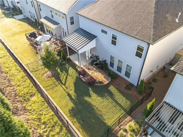 a aerial view of a house with swimming pool