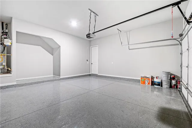 a view of storage and utility room with toys and a ceiling fan