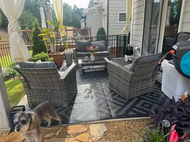 a view of balcony with furniture