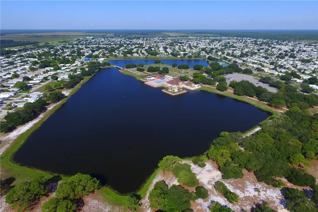 an aerial view of a houses with a yard