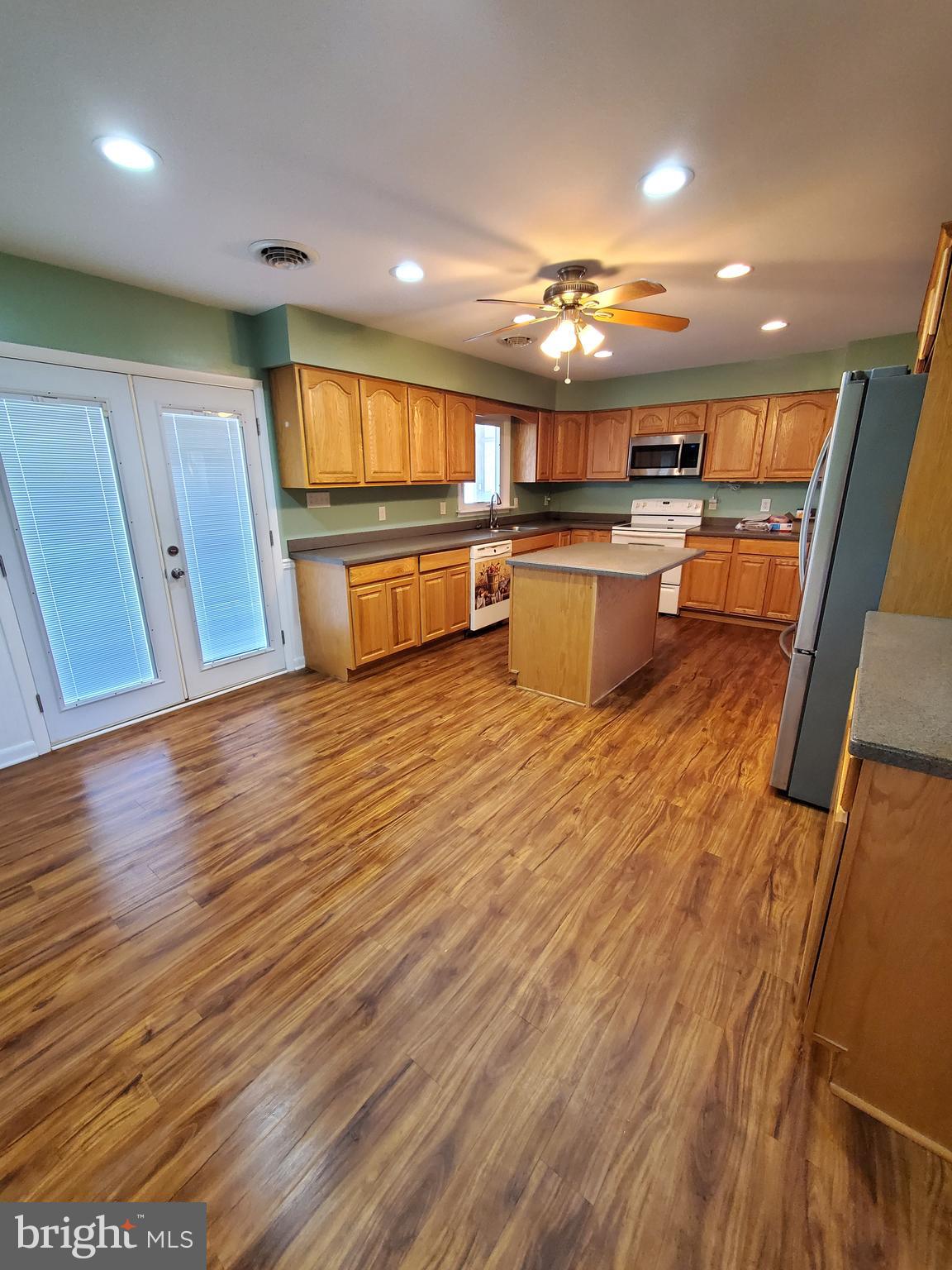 27113 Walnut Tree Road Salisbury, MD 21801 - Photo 22 of 58 Dining Area Looking Into Kitchen & Doors to Porch
