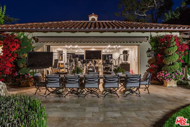 a view of a chairs and tables in patio
