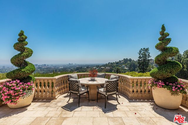 a view of a terrace with furniture
