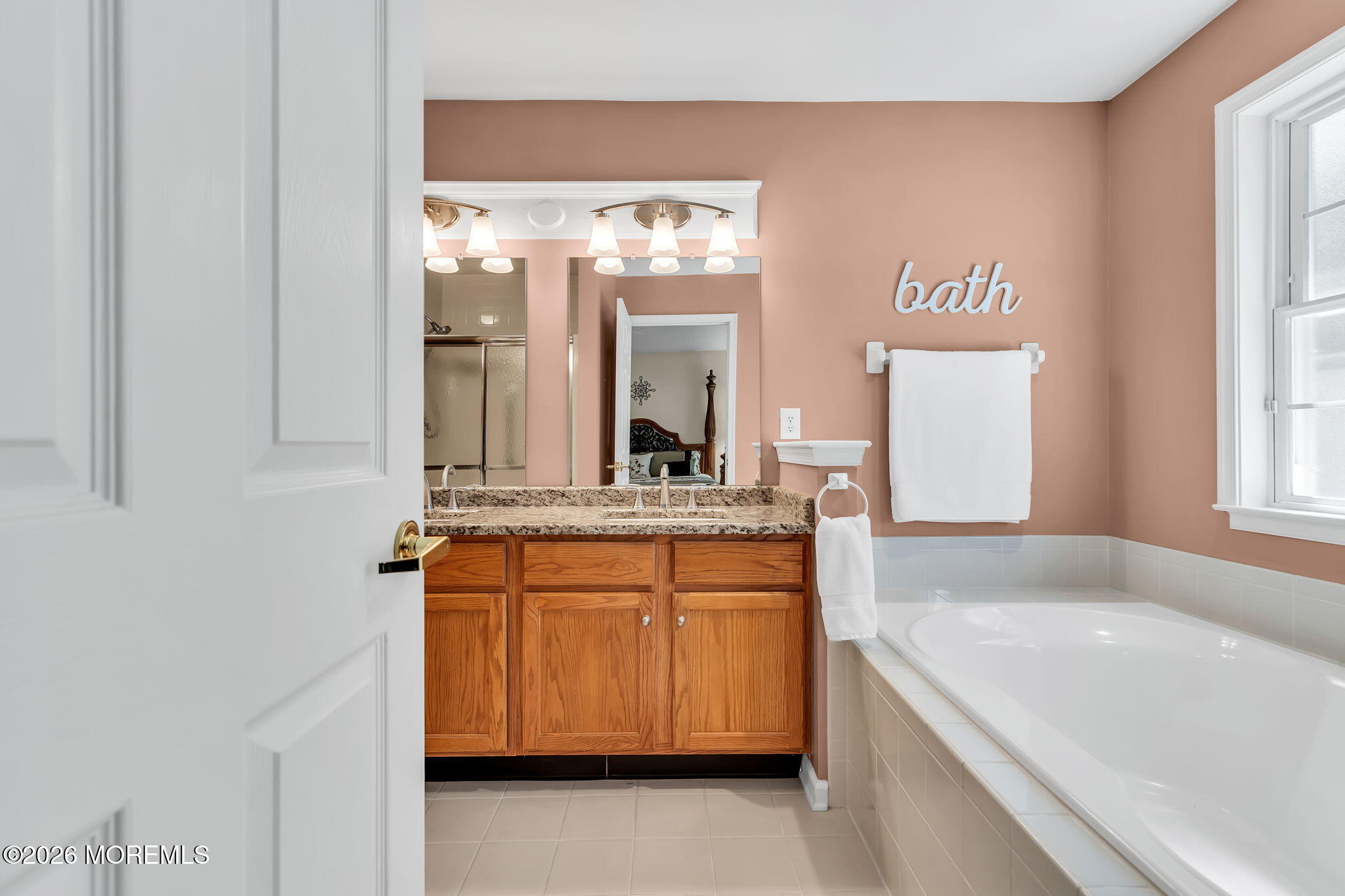 10 Congressional Road Jackson, NJ 08527 - Photo 42 of 72 a bathroom with a granite countertop sink and a mirror