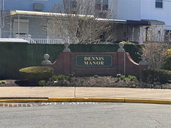 a view of outdoor space with signage and flags