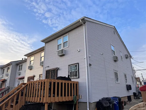 a front view of a house with a deck
