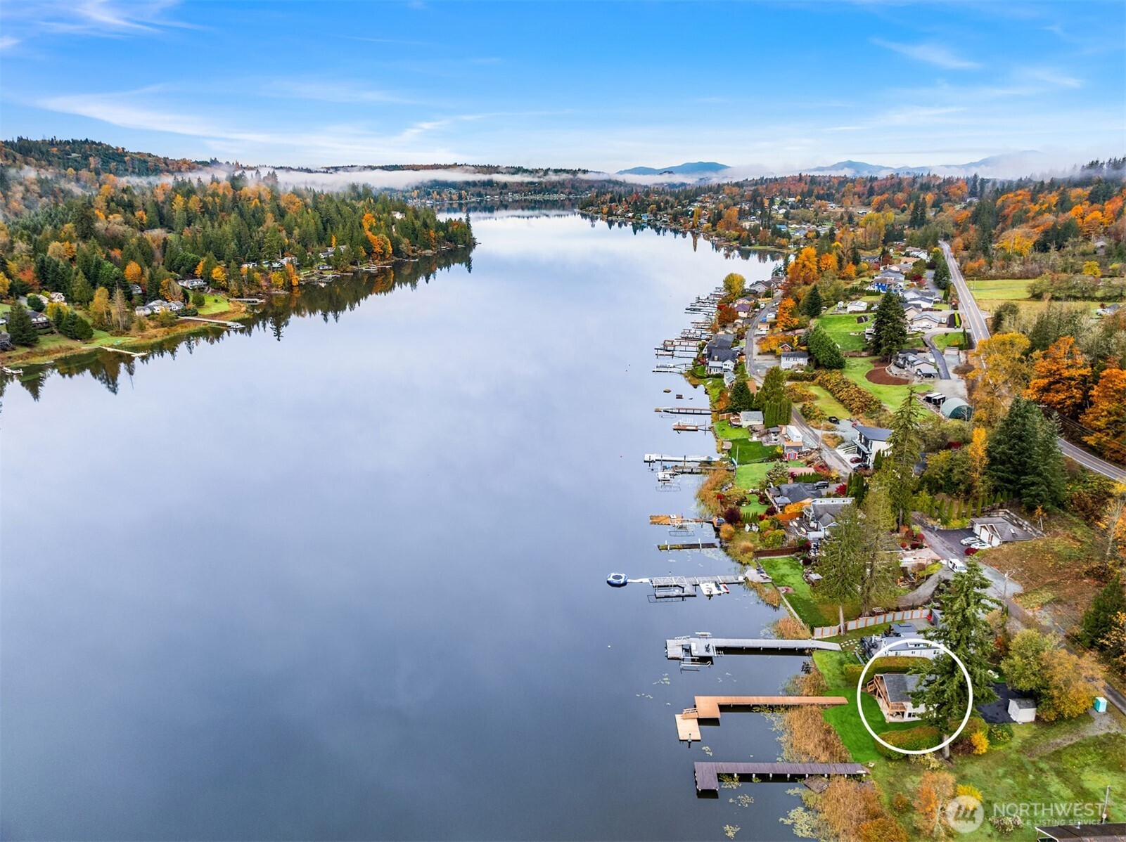 an aerial view of a house with a lake view