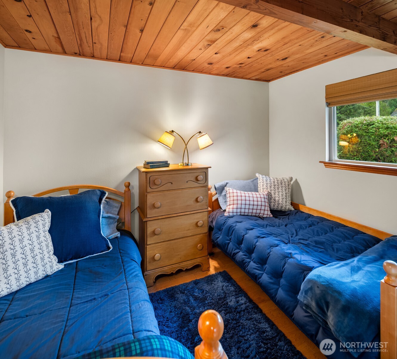 19110 Sulfur Springs Road Mount Vernon, WA 98274 - Photo 16 of 33 a bed sitting in a bedroom next to a window