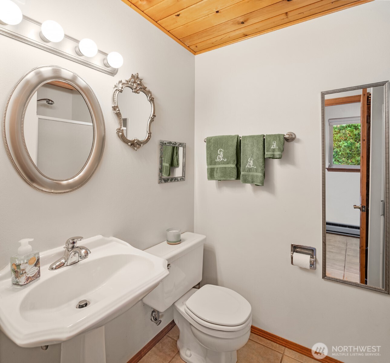 19110 Sulfur Springs Road Mount Vernon, WA 98274 - Photo 17 of 33 a bathroom with a sink mirror and toilet