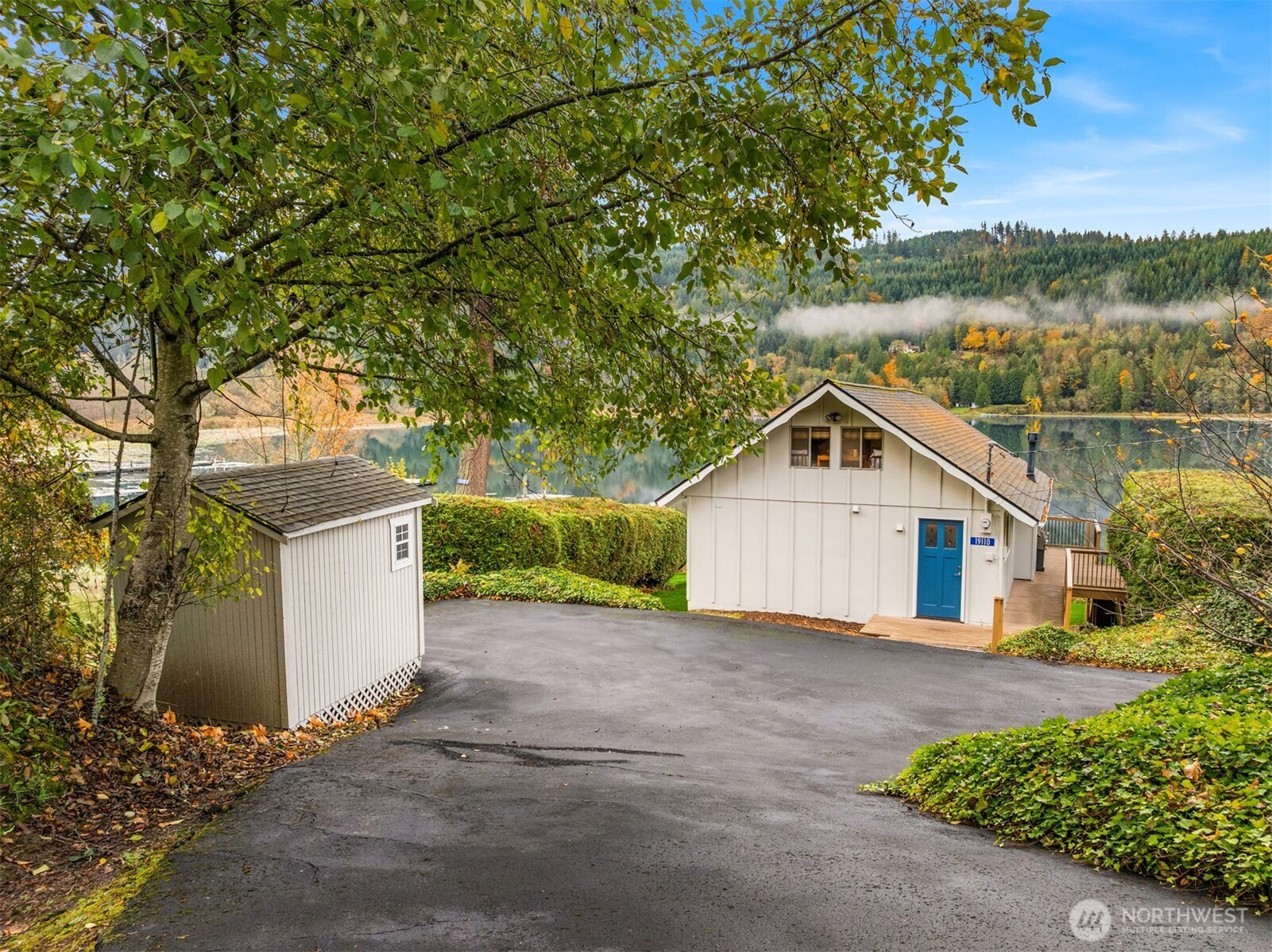 19110 Sulfur Springs Road Mount Vernon, WA 98274 - Photo 5 of 33 a view of a house with a yard and large tree
