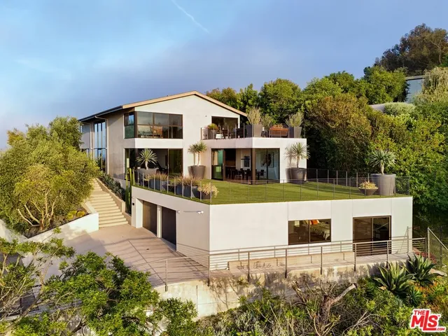 a view of house with a swimming pool